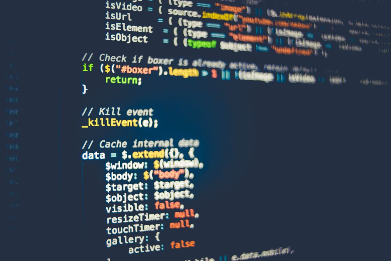About Close-up of colorful programming code displayed on a computer screen, showcasing modern coding concepts.